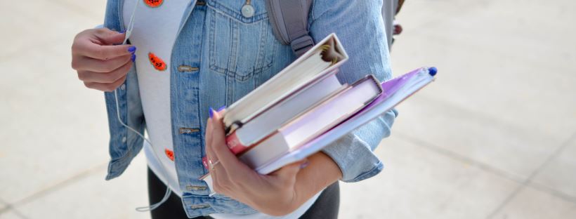 student carrying books