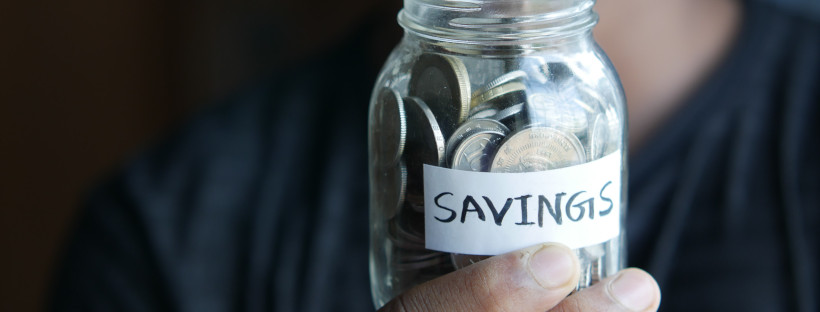 coins in a jar labeled savings